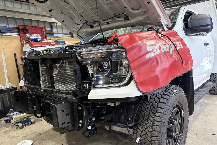 Mitch fitting an ARB bull bar to a Ford Super Duty in the MBC workshop, Kangaroo Flat build.