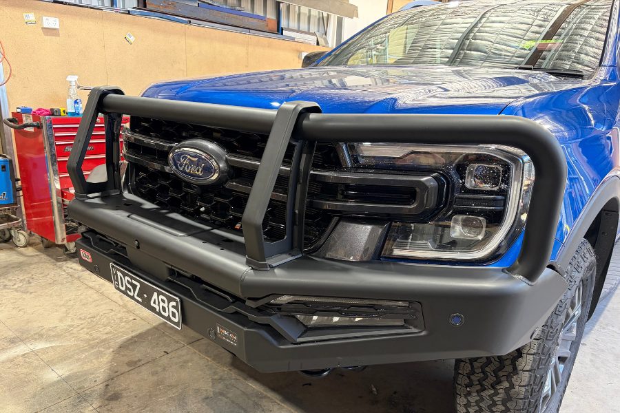 Mitch fitting an ARB Summit MK2 bull bar to a Next Gen Ranger Wildtrak in the MBC workshop, Bendigo.