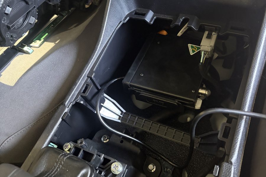 GME XRS370C UHF radio being wired into the Ford Super Duty dash at the MBC workshop, Bendigo.