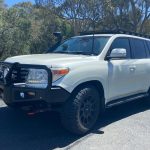 Completed Toyota 200 Series LandCruiser touring fitout with ARB Deluxe Big Tube bull bar, Warn winch, Safari snorkel and ARB Base Rack fitted by MBC 4X4 Solutions for a Geelong customer