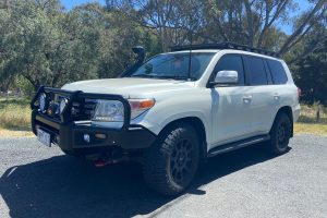 Completed Toyota 200 Series LandCruiser touring fitout with ARB Deluxe Big Tube bull bar, Warn winch, Safari snorkel and ARB Base Rack fitted by MBC 4X4 Solutions for a Geelong customer