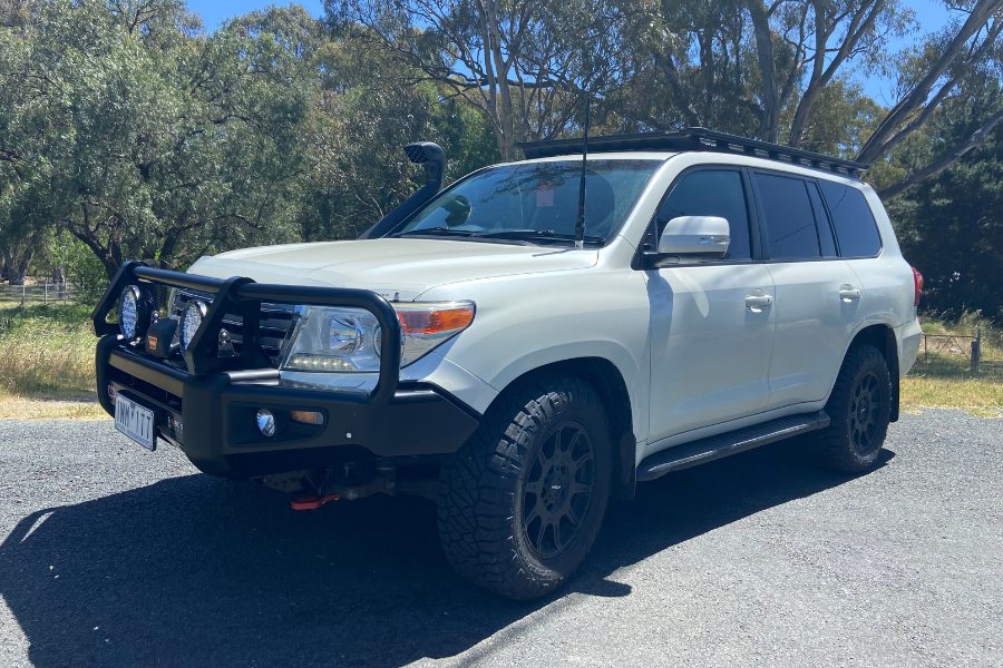 Completed Toyota 200 Series LandCruiser touring fitout with ARB Deluxe Big Tube bull bar, Warn winch, Safari snorkel and ARB Base Rack fitted by MBC 4X4 Solutions for a Geelong customer