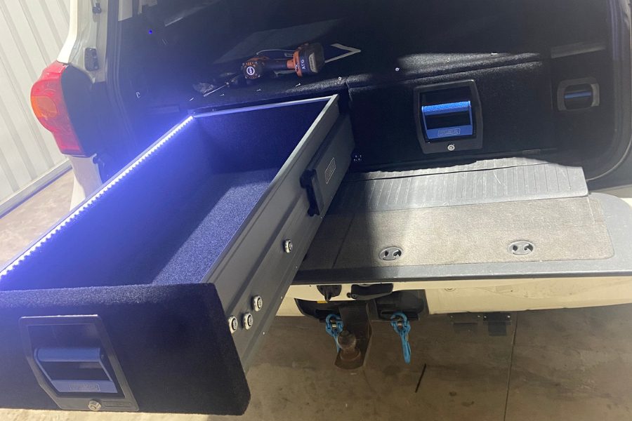 MSA drawer fitted to a Geelong customer's 200 Series LandCruiser with built-in LED interior lighting active during install at MBC 4X4 Solutions