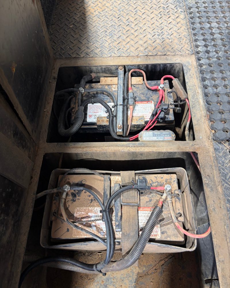 Tidied and fuse-protected twin 120Ah AGM dual battery wiring in an under-tray enclosure after MBC 4X4 Solutions, with a Red Arc BCDC1225D charger, near Kangaroo Flat
