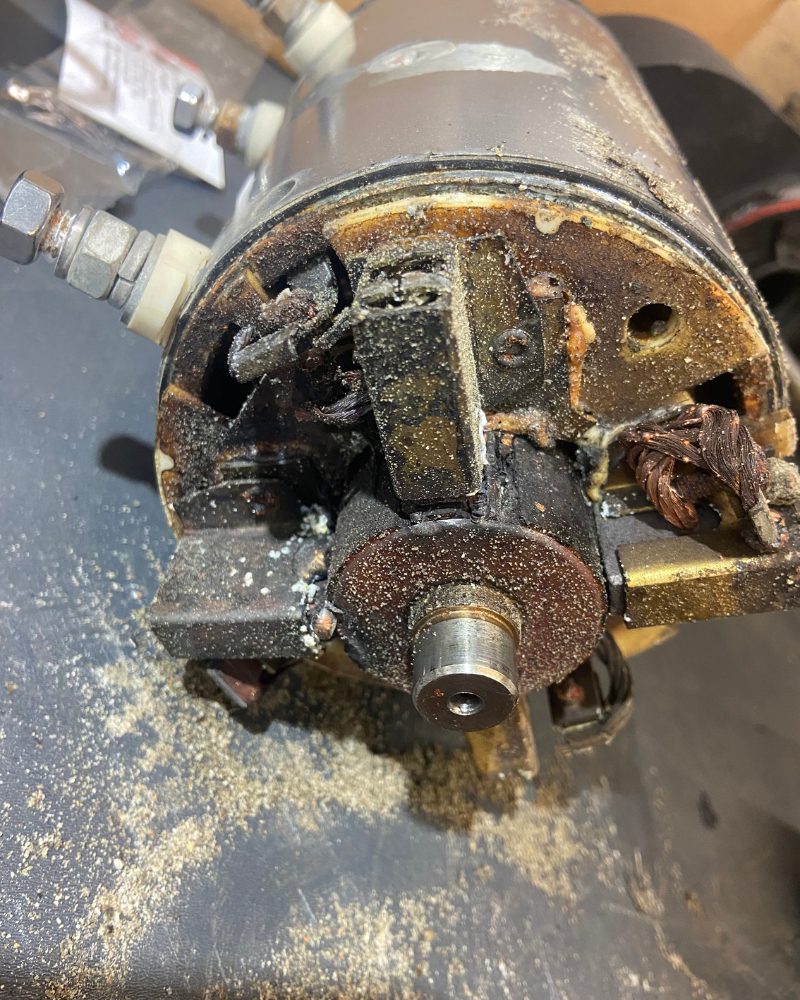 Warn winch motor with the cap removed during service by MBC 4X4 Solutions in Kangaroo Flat, showing obvious rust, water ingression and a heavily corroded motor brush box in need of service or replacement