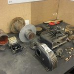 Warn high-mount winch fully disassembled on the MBC 4X4 Solutions workshop bench in Bendigo, all parts cleaned and itemised into groups and inspected before reassembly during a professional 4x4 winch service