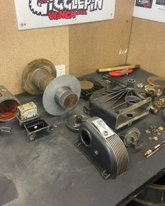 Warn high-mount winch fully disassembled on the MBC 4X4 Solutions workshop bench in Bendigo, all parts cleaned and itemised into groups and inspected before reassembly during a professional 4x4 winch service